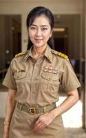 Foto von Mitte alt asiatisch Frau im thailändisch Lehrer Uniform, generativ ai