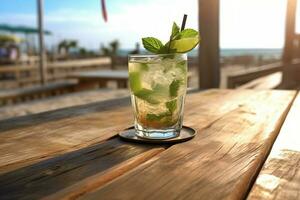 ein erfrischend Glas von typisch kubanisch Mojito mit ein Zweig von Minze Sitzung auf ein Tabelle in der Nähe von ein Strand foto