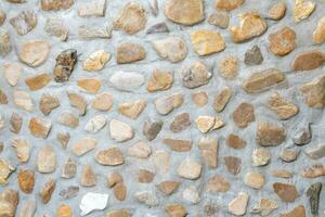 bunt Jahrgang Stein Mauer benutzt zum Hintergrund Textur im dekorativ Kunst arbeiten. foto