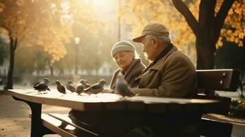 Großeltern Tag. ein Alten Paar im das Park auf ein Bank Futter Tauben. ai generiert. foto