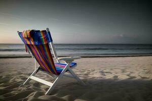 ein Strand Stuhl Sitzung auf oben von ein sandig Strand. ai generiert foto