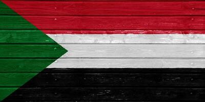 Flagge von Republik von Sudan auf ein texturiert Hintergrund. Konzept Collage. foto