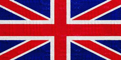 Flagge von großartig Großbritannien auf ein texturiert Hintergrund. Konzept Collage. foto