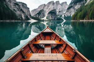 hölzern Rudern Boot auf szenisch See mit Berge im Hintergrund. generativ ai foto