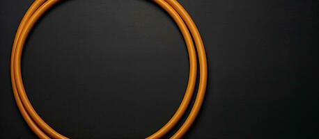 Foto von ein Orange Kabel auf ein schwarz Oberfläche mit leeren Raum zum Text oder andere Elemente mit Kopieren Raum