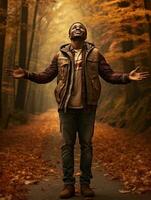 afrikanisch Mann im emotional dynamisch Pose auf Herbst Hintergrund ai generativ foto