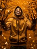 afrikanisch Mann im emotional dynamisch Pose auf Herbst Hintergrund ai generativ foto