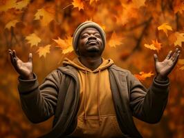 afrikanisch Mann im emotional dynamisch Pose auf Herbst Hintergrund ai generativ foto