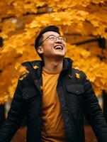 Foto von emotional dynamisch Pose asiatisch Mann im Herbst ai generativ