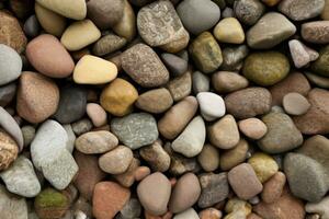 Felsbrocken Kieselstein Strand Steine Hintergrund Textur zum Design verwenden, natürlich gerundet Kies beim Meer Ufer Natur Hintergrund Textur Muster foto