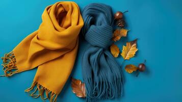 Orange und Blau gestreift gestrickt Hüte und Schal zum das kalt Jahreszeiten. Ahorn Blätter und warm Kleidung. erstellt mit generativ al Technologie foto