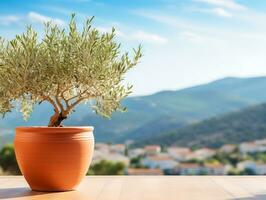 Olive Baum im terra Cotta Lehm Topf auf Weiß Terrasse unter klar Blau Himmel mit schön Berge Aussicht generativ ai foto