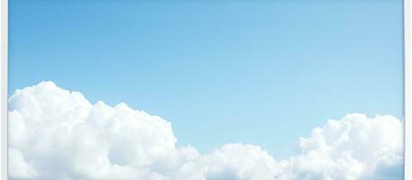 ein Blau Himmel mit Licht Wolken dient wie das Hintergrund zum ein Weiß rahmen, Bereitstellung ein Kopieren Raum foto