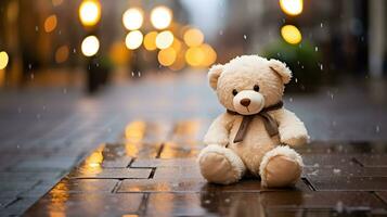 Teddy Bär Spielzeug Sitzung auf das Straße Fußboden im Regen foto