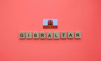 September 10, Gibraltar National Tag, Flagge von Gibraltar, minimalistisch Banner mit das Inschrift im hölzern Briefe foto