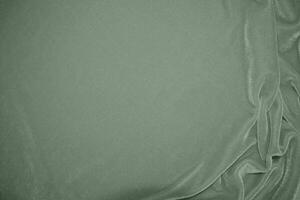 Olive Grün Farbe Samt Stoff Textur benutzt wie Hintergrund. Grün Farbe Panne Stoff Hintergrund von Sanft und glatt Textil- Material. zerquetscht Samt .Luxus golden Ton zum seidenrosa Gold foto