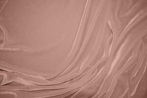 Rose Gold Farbe Samt Stoff Textur benutzt wie Hintergrund. blond Farbe Panne Stoff Hintergrund von Sanft und glatt Textil- Material. zerquetscht Samt .Luxus golden Ton zum seidenrosa Gold foto