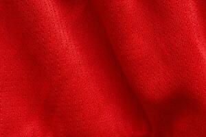 roter sportbekleidungsstoff fußballtrikot trikot textur hintergrund foto