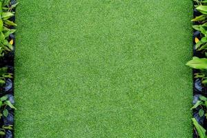 Draufsichtfoto, künstlicher grüner Grasbeschaffenheitshintergrund