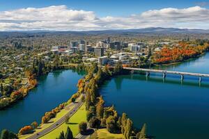 Antenne Aussicht von Stadtbild im Herbst, Melbourne, Australien. Antenne Drohne Panorama- Aussicht suchen beim Victoria Brücke Über das Waikato Fluss wie es schneidet durch das Stadt von Hamilton, ai generiert foto