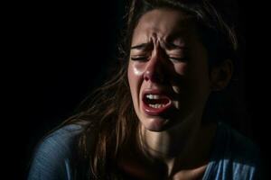 ein jung Frau ist Weinen im ein dunkel Zimmer generativ ai foto