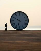ein Person Stehen im Vorderseite von ein groß Uhr generativ ai foto