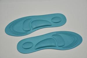 neue orthopädische blaue Schuhsohlen foto
