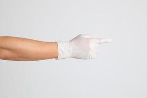 Hand mit medizinischen Handschuhen foto