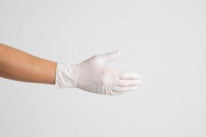 Hand mit medizinischen Handschuhen foto