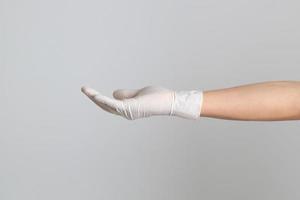 Hand mit medizinischen Handschuhen foto