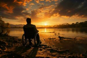 Rollstuhl Silhouette, einstellen gegen das Hintergrund von ein Sonnenuntergang, strahlt Entschlossenheit ai generiert foto