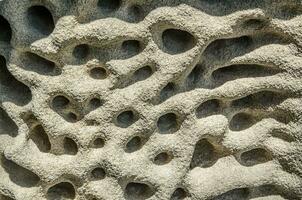 Bimsstein, Lava Felsen Stein Textur voll von Löcher und abstrakt Muster, Staub form, ist ein vulkanisch Felsen Das besteht von höchst vesikulär grob strukturiert. foto