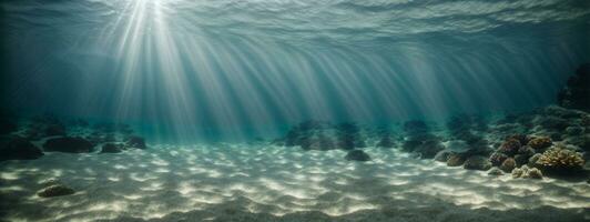 unter Wasser Hintergrund tief Blau Meer und schön Licht Strahlen mit sandig Boden. ai generiert foto