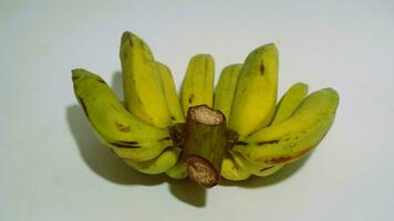 Banane isoliert Weiss, ein Beliebt Obst Das ist einfach zu Essen durch entfernen es ist dick Haut, musa paradiesisch, enthält Vitamine A, C, und b6 zu Boost das Körper Immunität. foto