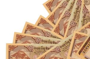 10 Nepalese Rupien Rechnungen Lügen im anders bestellen isoliert auf Weiß. lokal Bankwesen oder Geld Herstellung Konzept foto