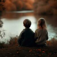 ein Junge und Mädchen sitzen auf ein Felsen suchen beim das Wasser generativ ai foto