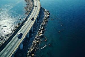 Antenne Aussicht von ein Brücke Straße mit ein wenige Autos Über ein Blau Ruhe See foto