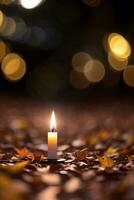 Foto von das Kerze und fallen Blätter Hintergrund