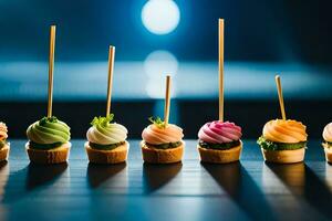 ein Reihe von Mini Cupcakes mit Zahnstocher. KI-generiert foto