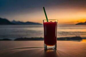 ein Glas von rot Saft auf ein Tabelle im Vorderseite von das Ozean. KI-generiert foto