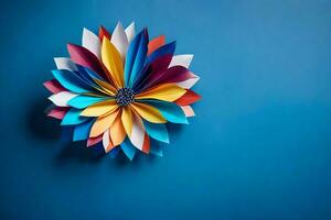 ein bunt Papier Blume auf ein Blau Hintergrund. KI-generiert foto