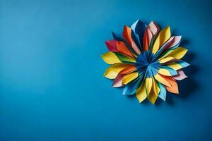 ein bunt Origami Blume auf ein Blau Mauer. KI-generiert foto