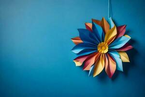 ein bunt Papier Blume hängend auf ein Blau Mauer. KI-generiert foto