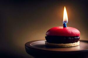 ein klein rot Kuchen mit ein Kerze auf oben. KI-generiert foto