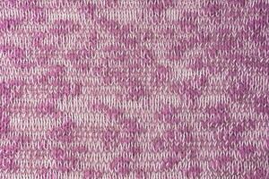 hell Rosa Weiß melange Strickwaren wolle Stoff Textur Hintergrund. abstrakt Textil- Hintergrund foto