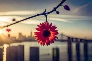 ein rot Blume hängend von ein Ast im Vorderseite von ein Stadt Horizont. KI-generiert foto
