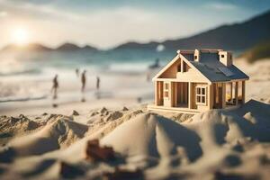 ein Miniatur Haus auf das Strand mit Menschen im das Hintergrund. KI-generiert foto