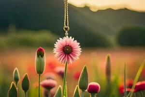 ein Rosa Blume ist hängend von ein Halskette im ein Feld. KI-generiert foto