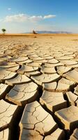 getrocknet Land im das Wüste geknackt Boden Kruste Klima Veränderung Vertikale Handy, Mobiltelefon Hintergrund ai generiert foto