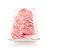 frisches Schweinefleisch in Scheiben geschnitten mit Zutaten foto